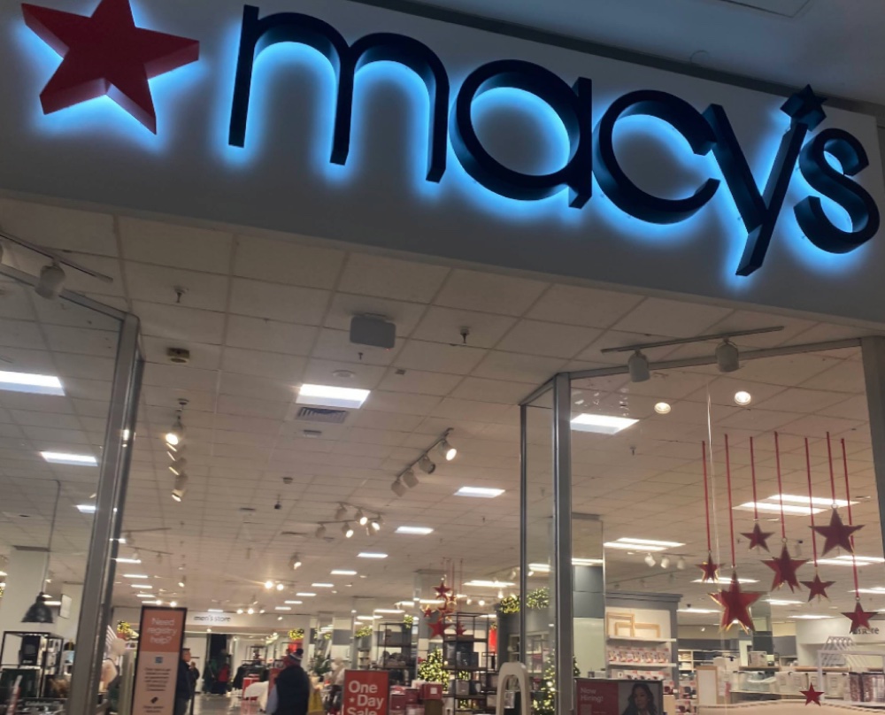 Storefront at night, marking the move to the US